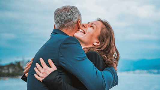 A man and woman hugging - A Guide to Thanking Your Funeral Guests