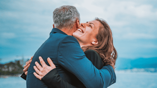 A man and woman hugging - A Guide to Thanking Your Funeral Guests